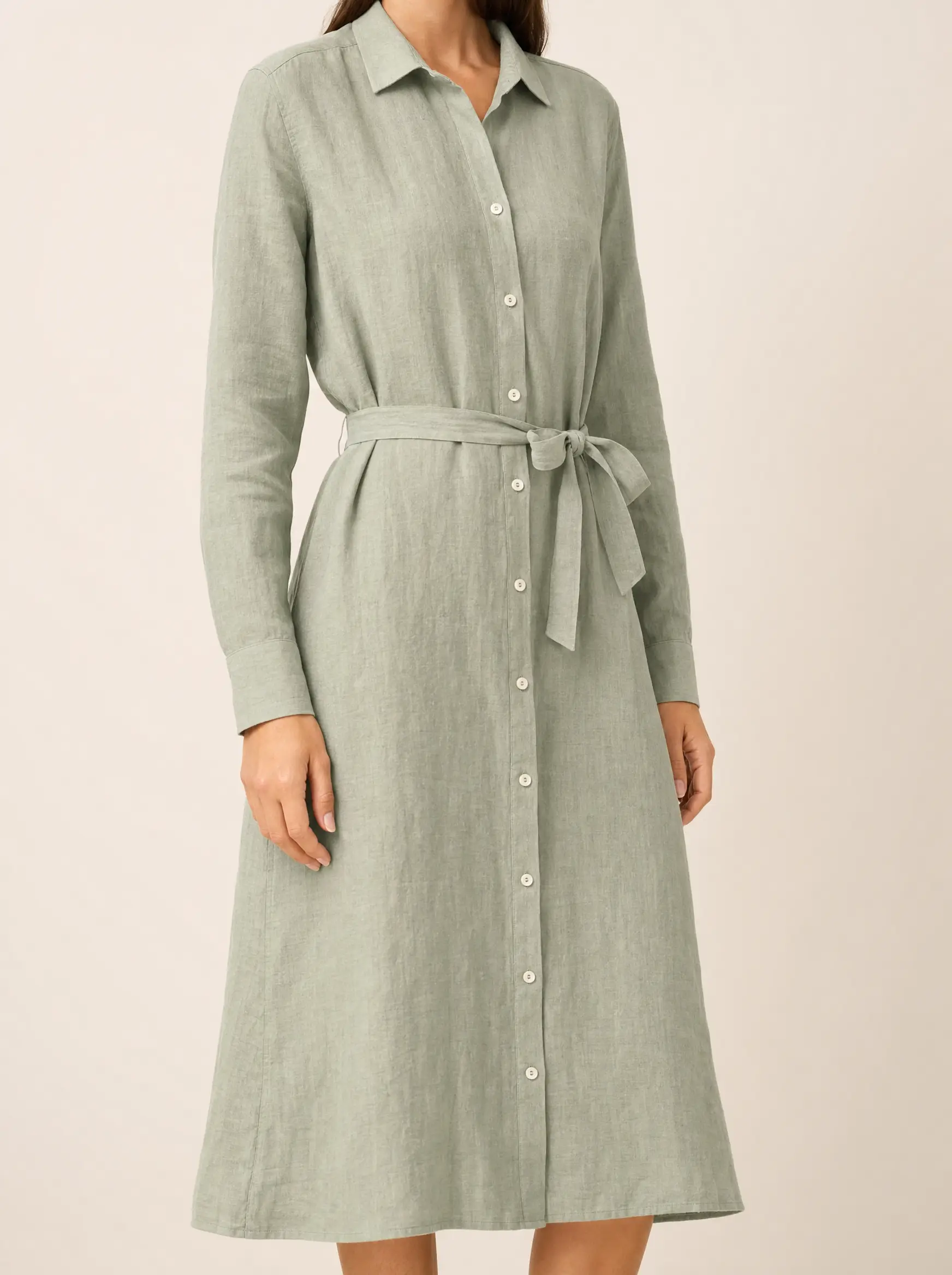 The same linen dress worn by a model on a studio backdrop